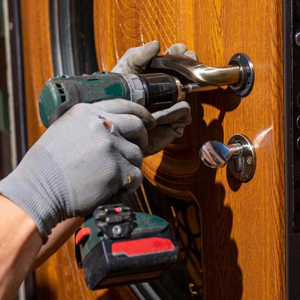 Technician repairing an access control system for an office in Charleston.